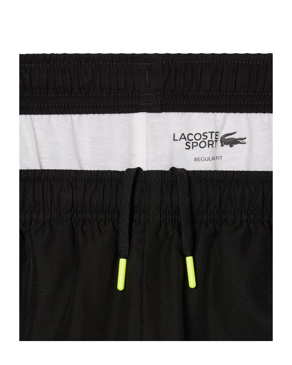 LACOSTE Tuta Lacoste uomo WH4757 Nero riga centrale con logo e bordi a contrasto WH4757 031