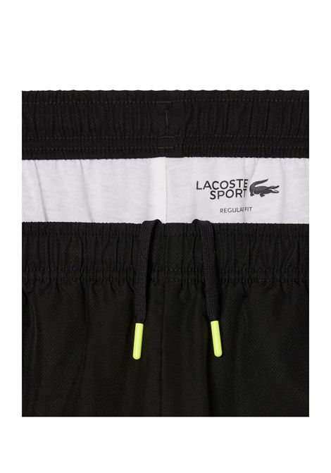 Tuta Lacoste uomo WH4757 Nero riga centrale con logo e bordi a contrasto LACOSTE | Tute | WH4757031